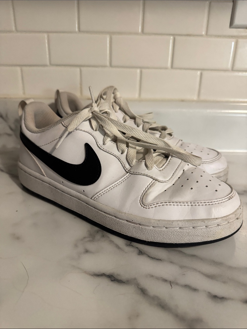 Nike Kids White Sneakers with Black Swoosh (women’s 7)